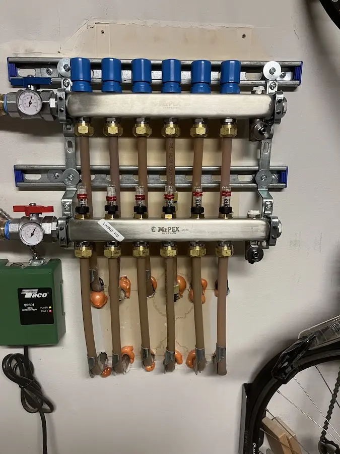 Plumber performing Gas Leak Detection at a residential property in Quincy